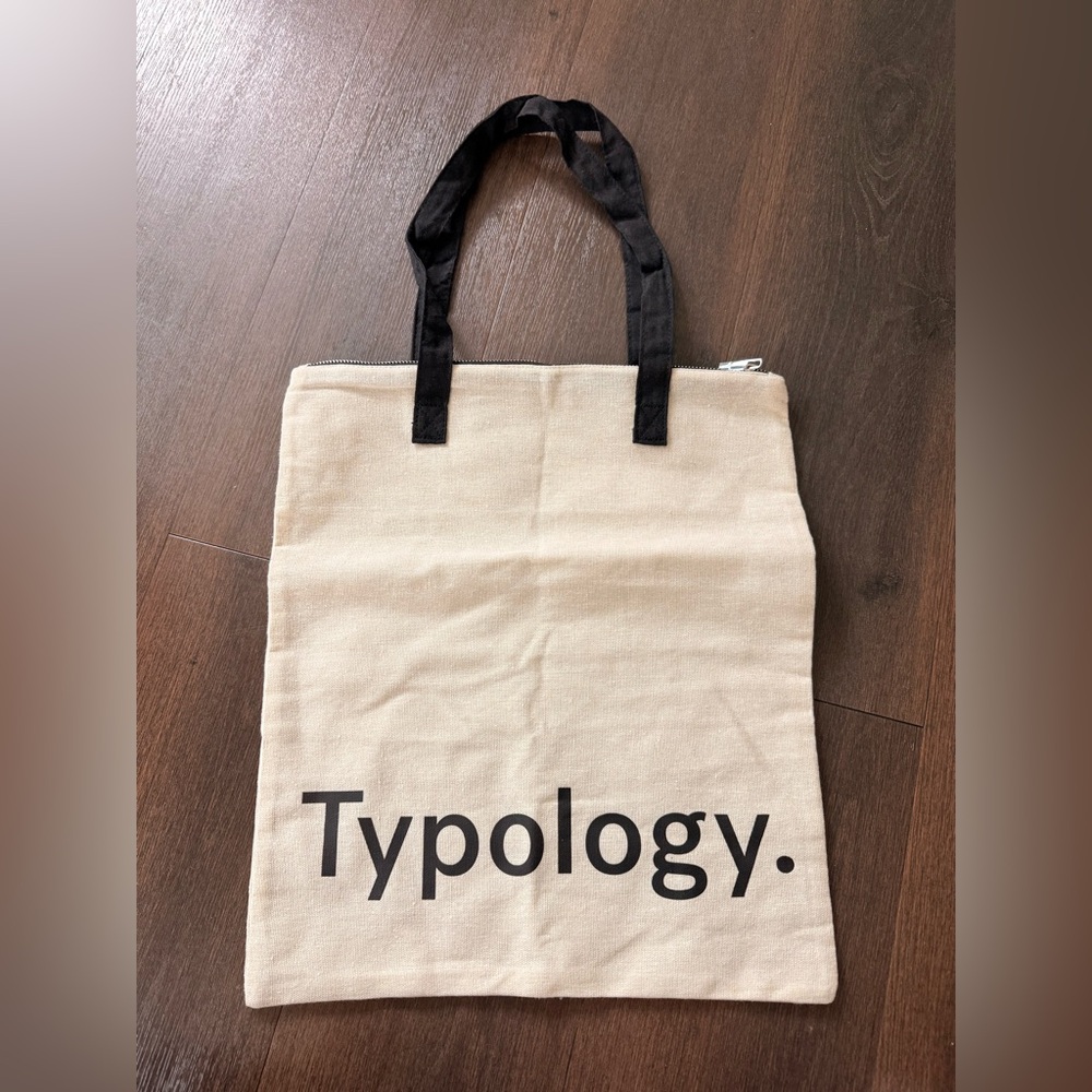 Typology. Canvas Tote Bag in Cream with Black Handles